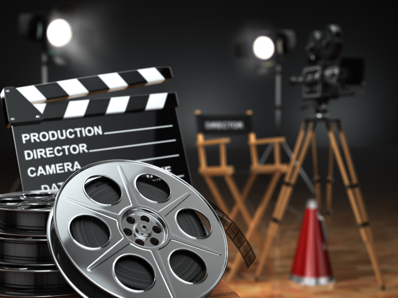 Video,  movie,  cinema concept. Retro camera,  reels, clapperboard